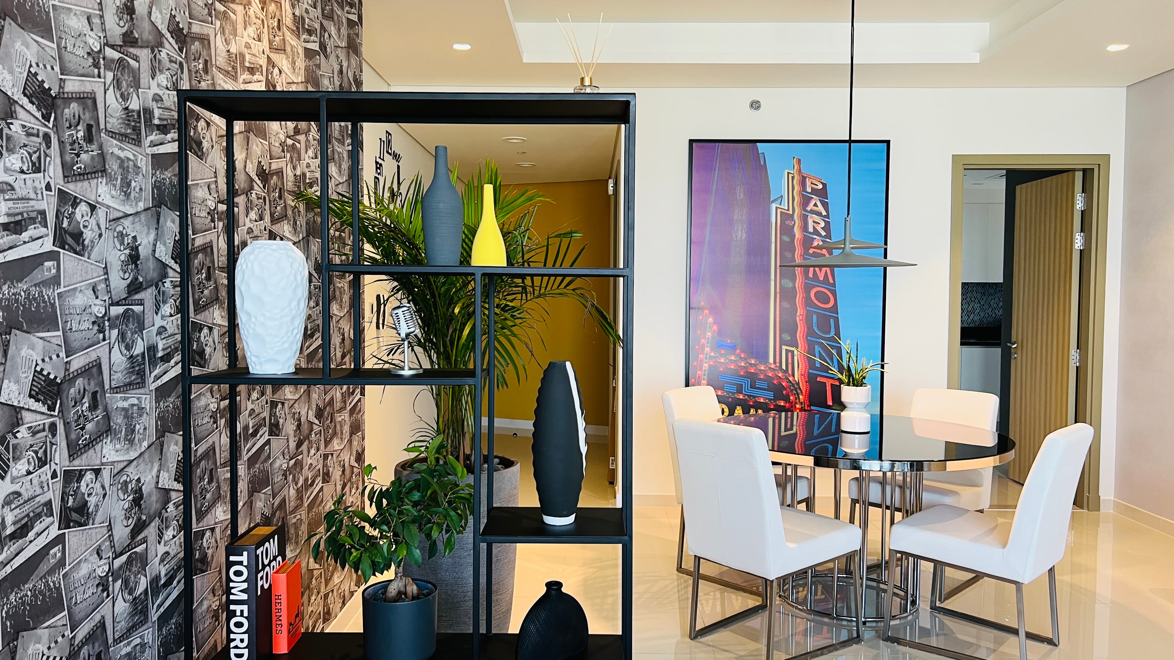 Dining area with Paramount theatre artwork and gold accents